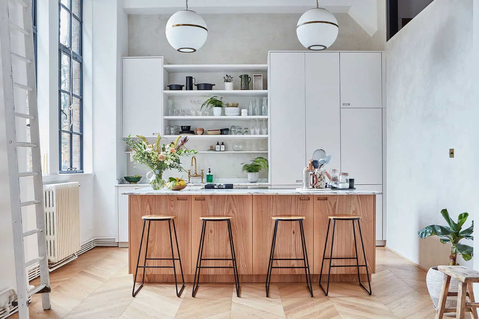 white kitchen with brown wooden island