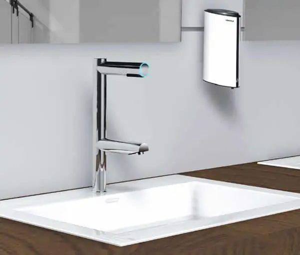 Liquid soap dispenser and basin faucet for bathrooms.