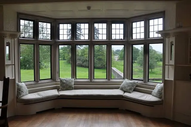 huge bay window with matching doors, white furniture and wooden texture flooring- check price