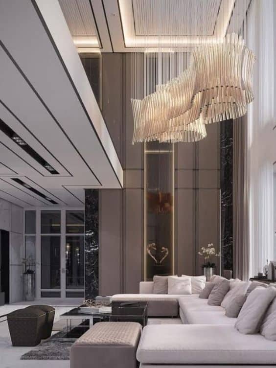 Building and Interiors layered false ceiling at different heights with tissue lighting fixture for hall