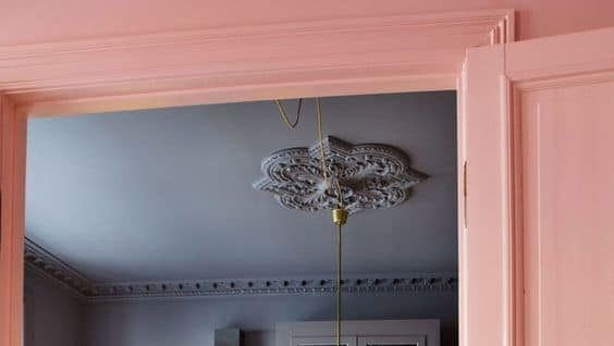 blue kitchen ceiling with walls and yellow cabinets with pastel peach doors