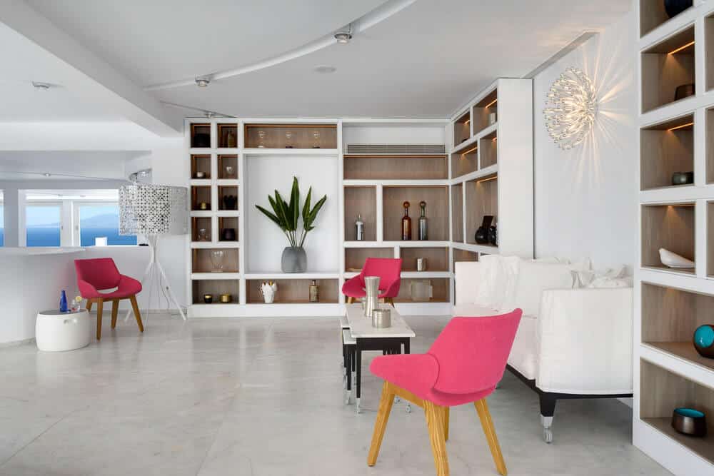 minimal look with designer lights white interiors and popping pink furniture