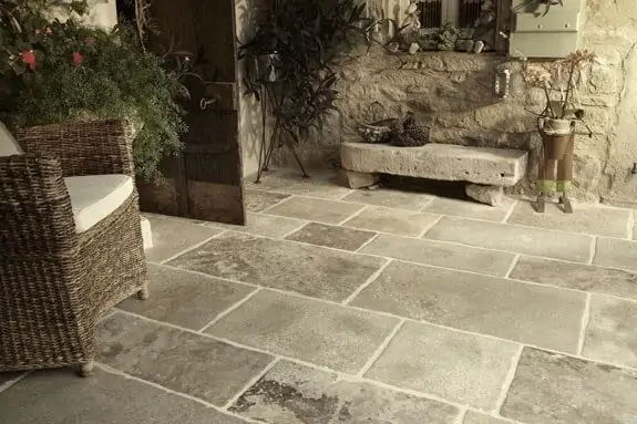 stone flooring for outdoor area with stone cladding and rustic furniture