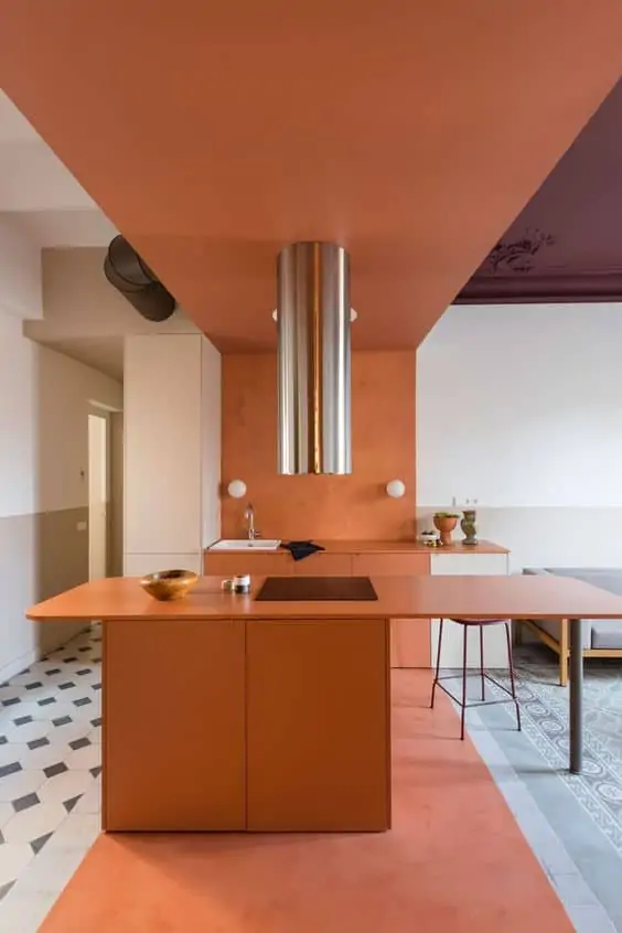 orange countertop with overhead pendant light with orange ceiling