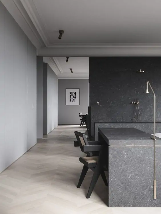 black engineered stone surface with black furniture and black walls