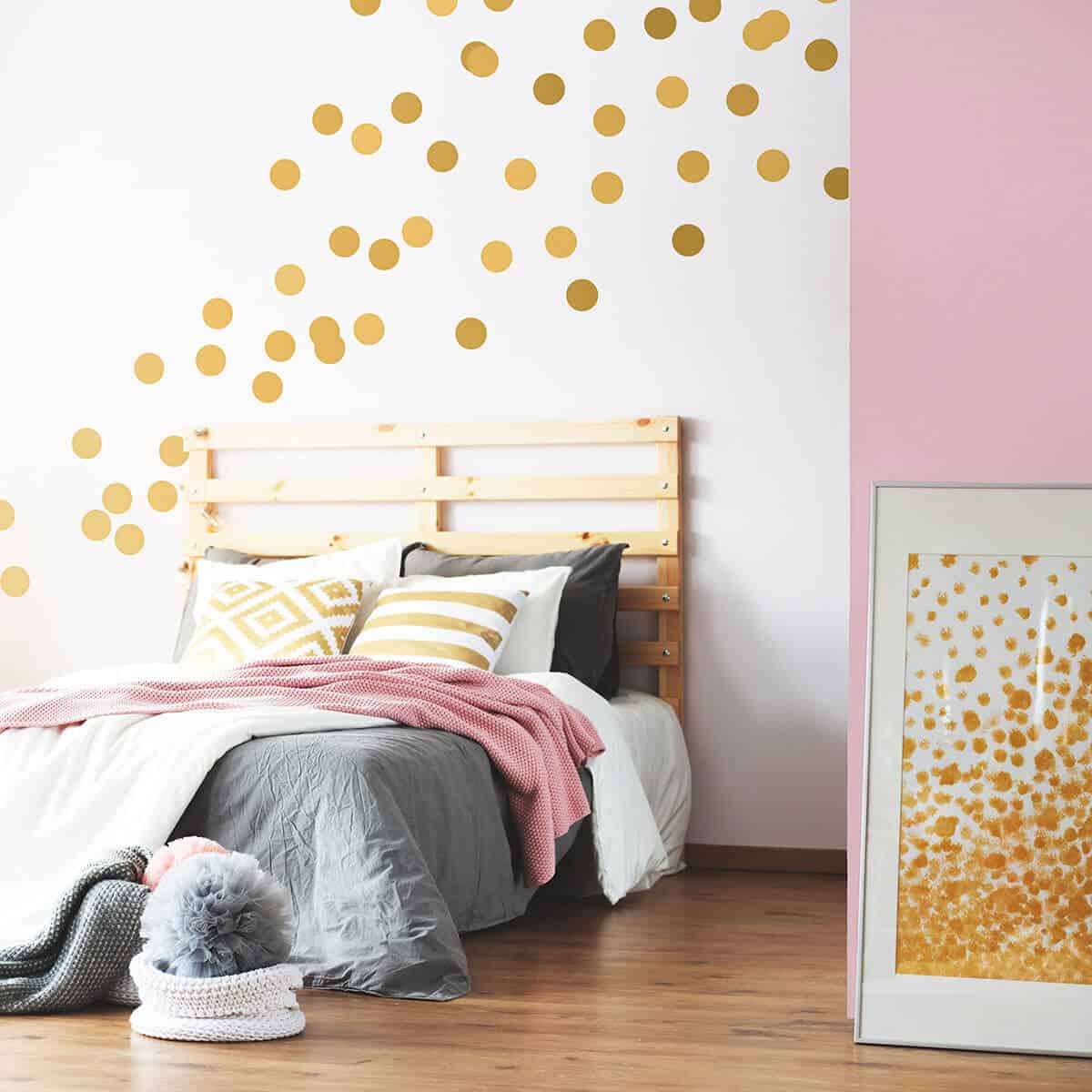 white bedroom wall design with gold stickers