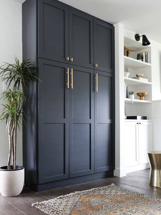 dark blue closet with golden handles