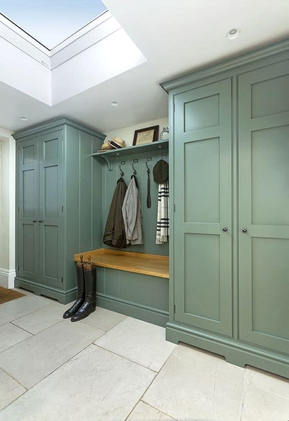 green closet with two doors on each side and a hanging section in the middle