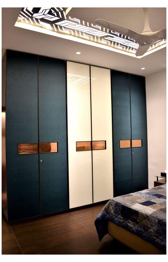 blue and white closet with 6 doors and golden handles
