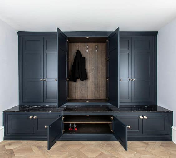 blue closet with 6 doors and huge bottom drawers