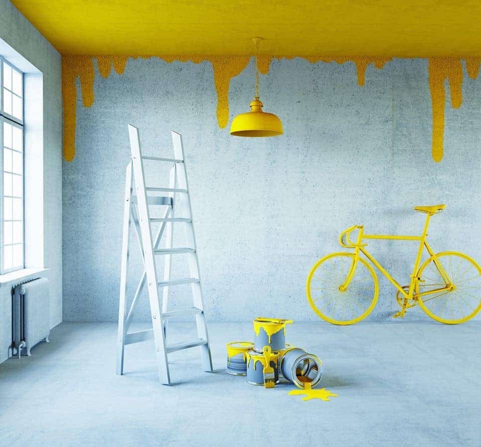 yellow and room room with cycle design paint on wall