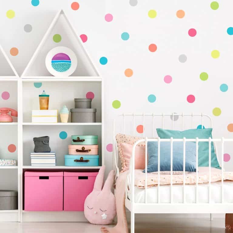soft bright polka dots on a white wall paint design 