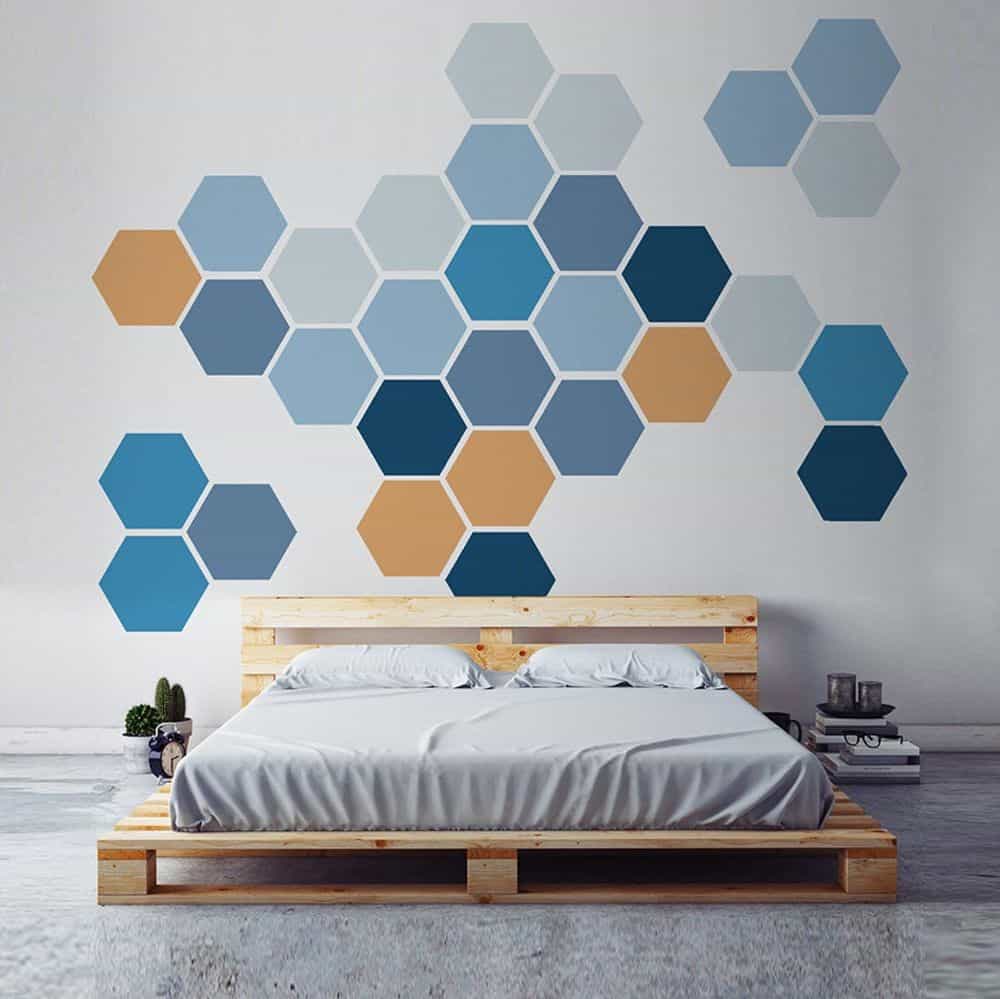 wall paint design with honeycomb pattern on a wall with shades of blue and orange 