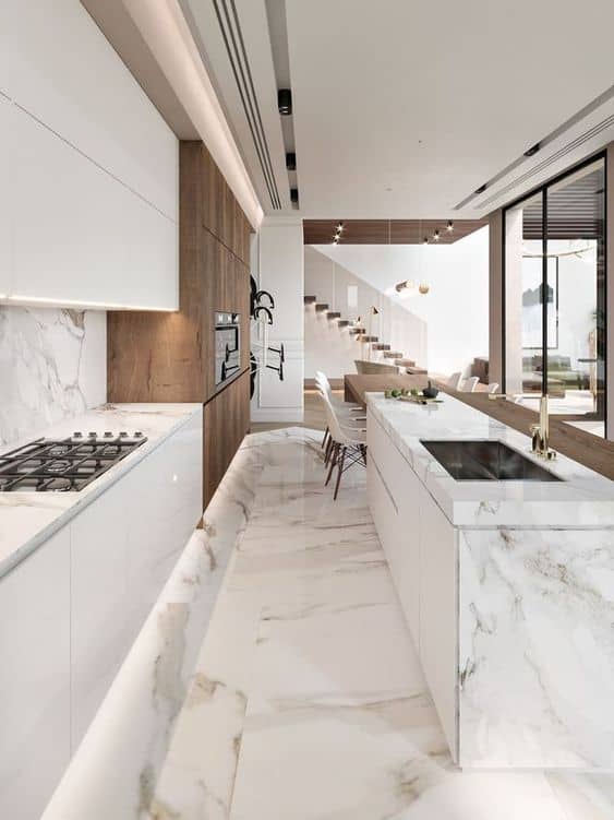 marble texture ceramic tiles for a kitchen with white counter top and cabinets.