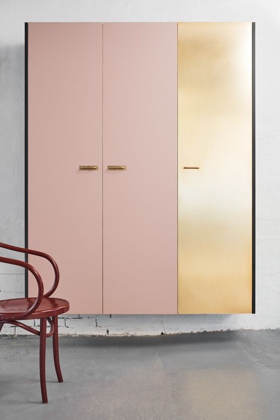 light pink and golden wall-mount closet.