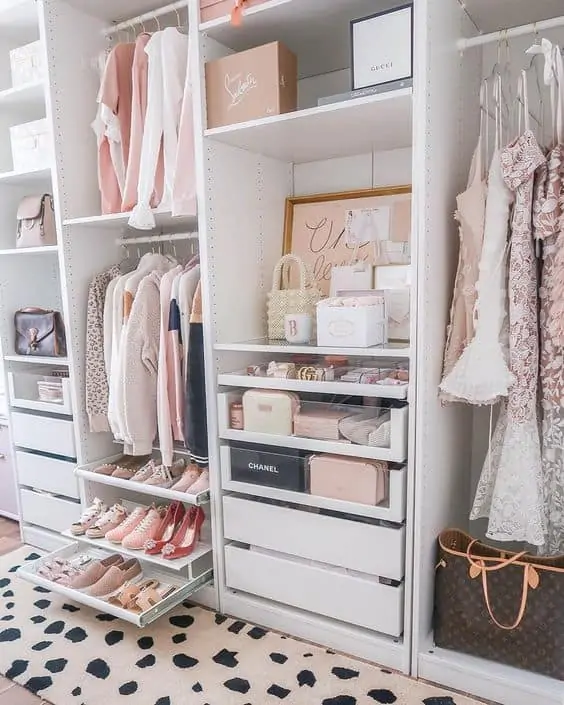 white closet with multiple drawers and shelves