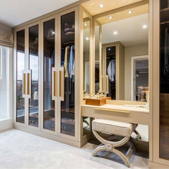 glass wardrobe with wooden panels with dressing table