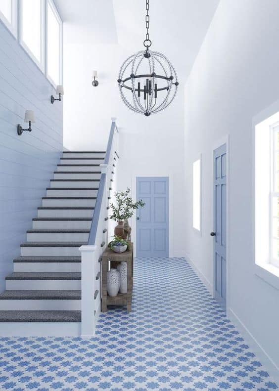 blue and white mosaic tiles for entrance hallway with white walls and blue doors
