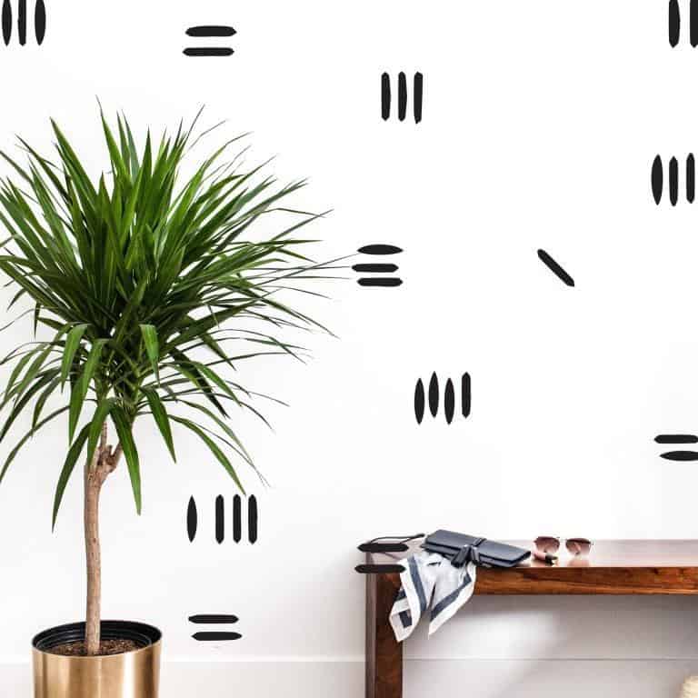 a white wall with black wonky stripes