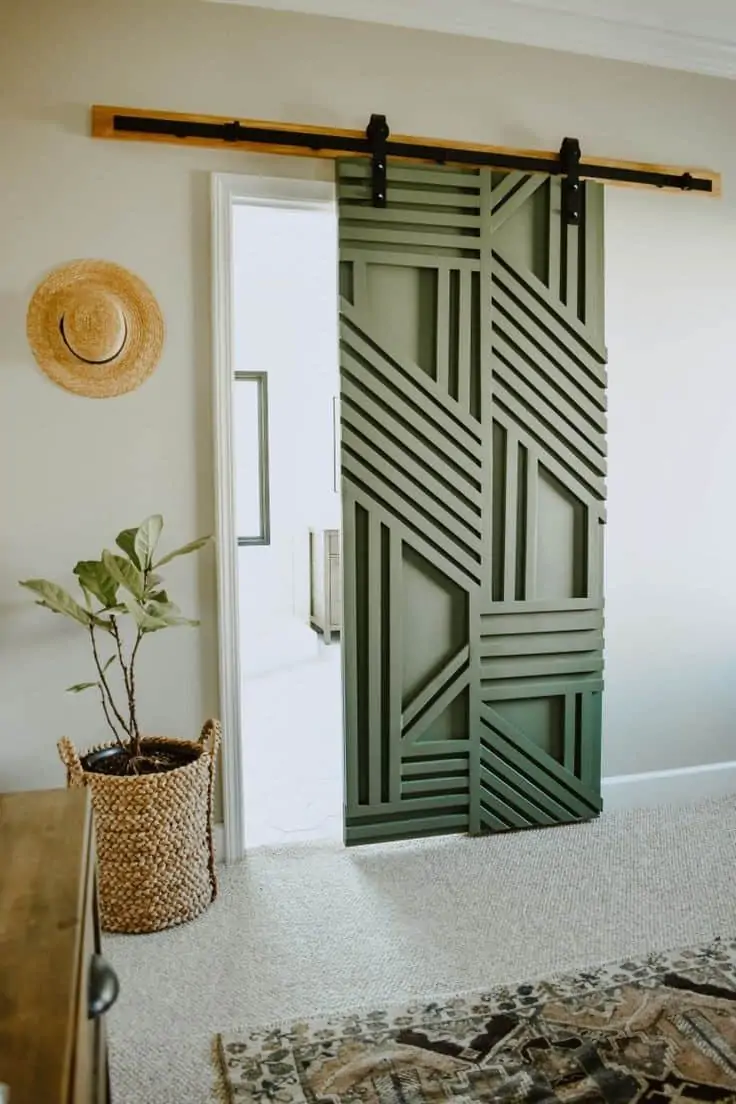 pastel green colored geometric sliding barn door design for a modern home