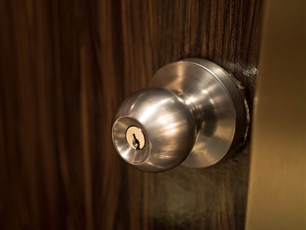 Knob lock on a brown door