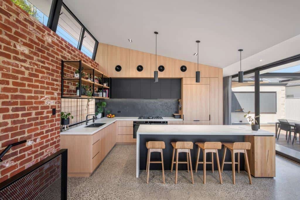 kitchen with an island and faux brick wall
