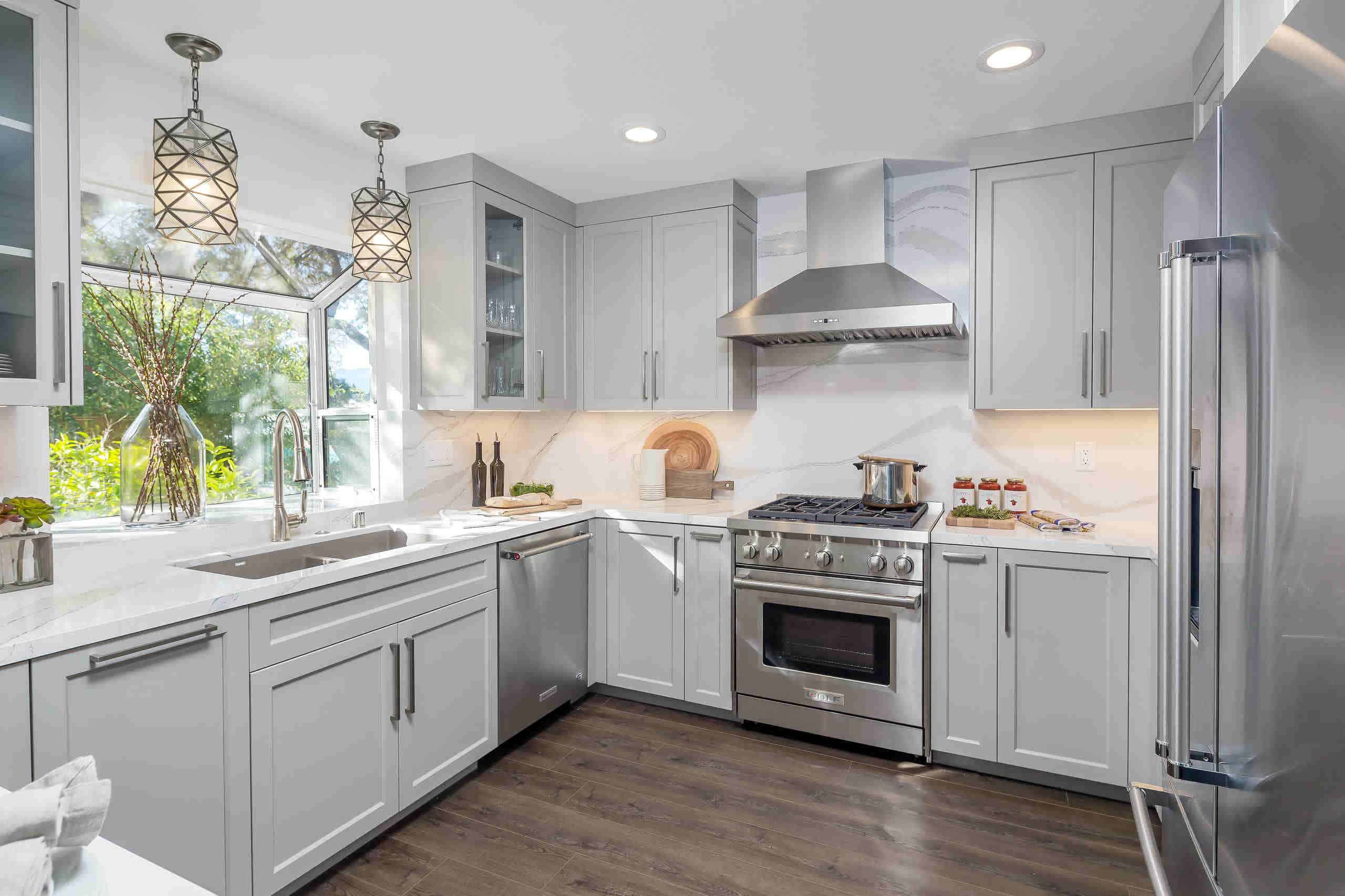 U-shaped kitchen with cabinets and light without island