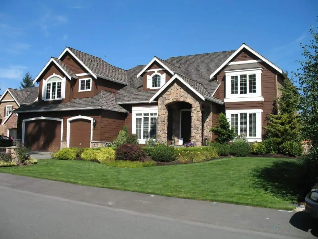  brown exterior of house with white trims