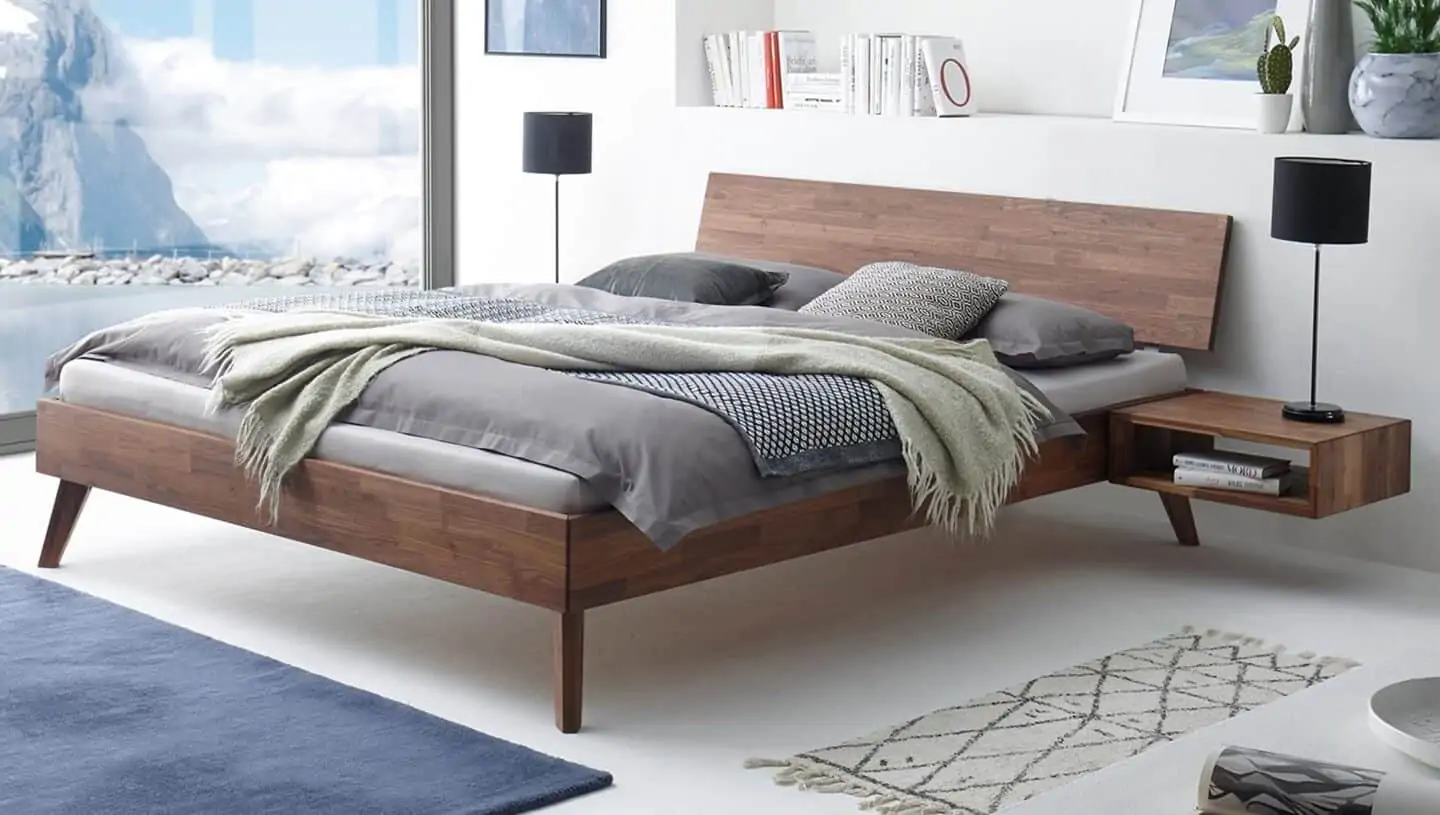 brown stained wooden bed
