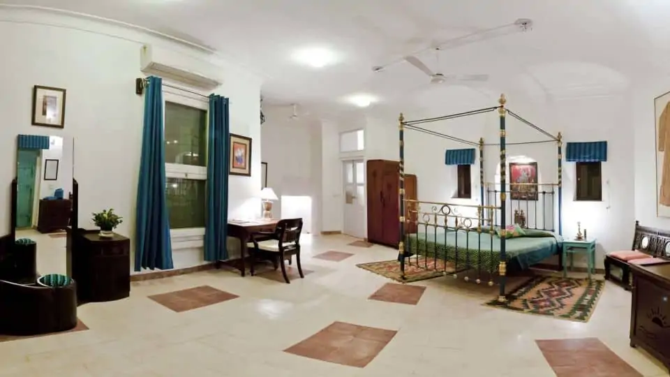 indian bedroom with metal poster bed