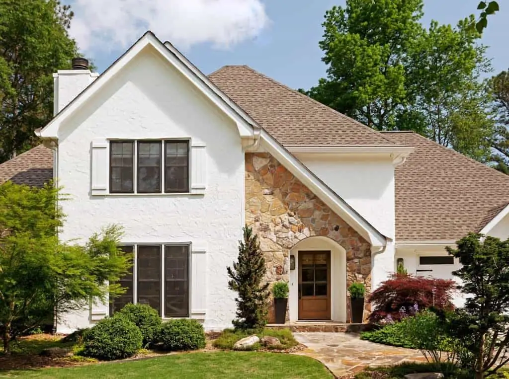 beige house exterior with brown roof