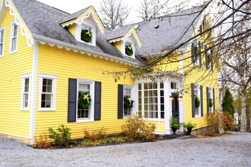  yellow house exterior with grey roof