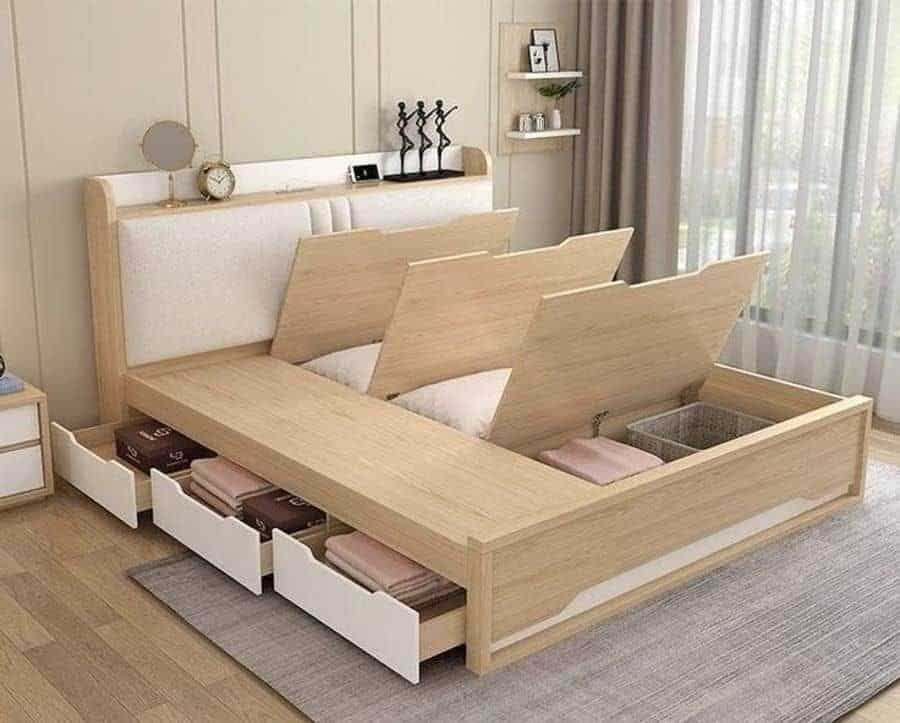 Bed with drawers and a concealed storage space