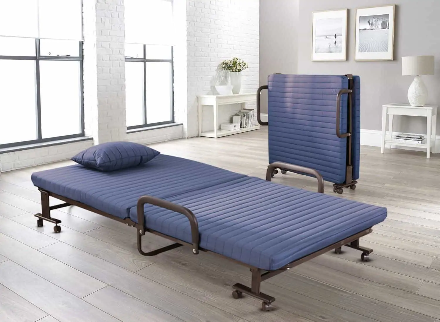  folding bed with blue mattress, space saving bed like a futon