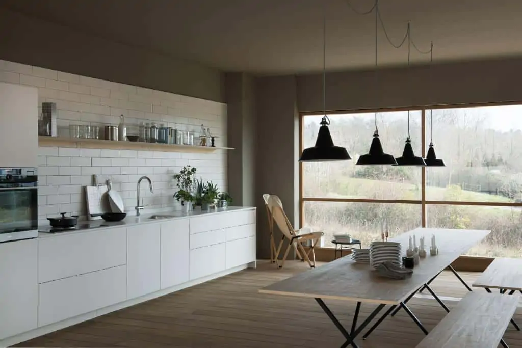 Designer kitchen in white colours with island, cabinet and cupboard