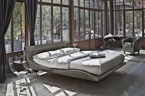 grey sleigh bed in rustic bedroom