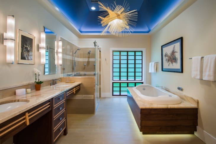 Layered bathroom false ceiling design in light and dark shades