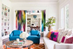 colourful room decor ideas for living room with blue sofa chairs and colourful throw pillows and brown rug