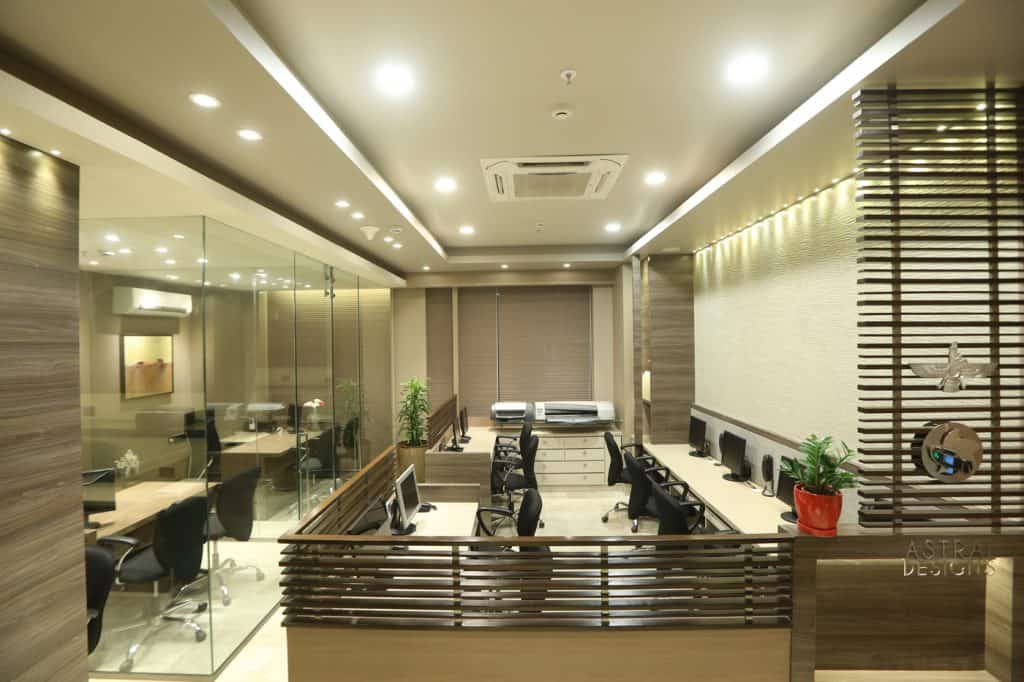 brown office with false ceiling and work stations 