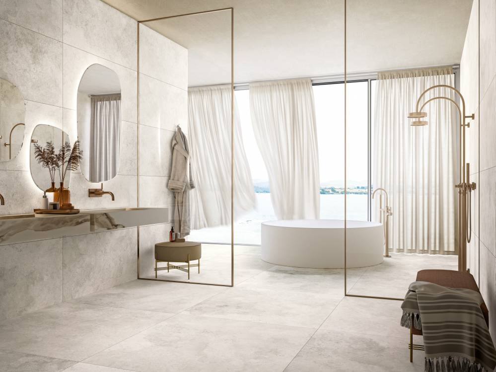 beige bath space with white bathtub, washbasin, mirror with light and a shower