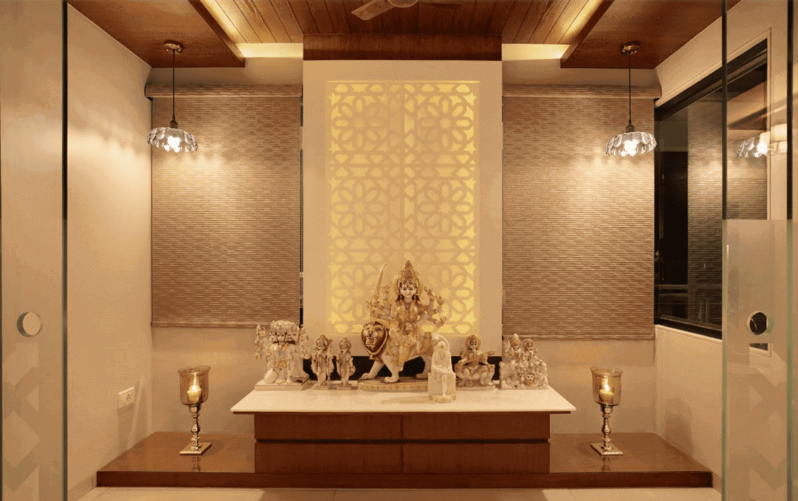 beige prayer room with pendant ligths and decorative candles