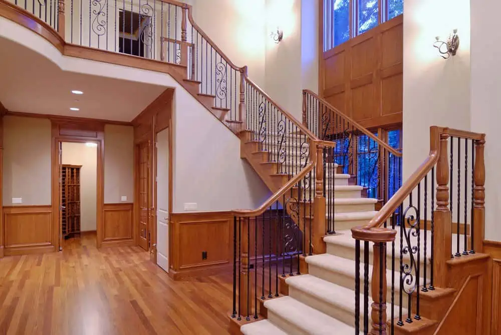 white stairs and brown railings