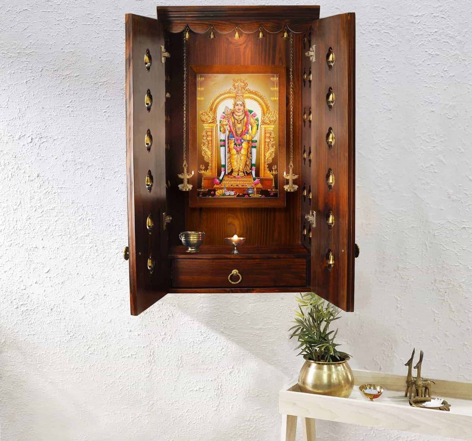 wooden mandir with multiple bells, ganesha idol