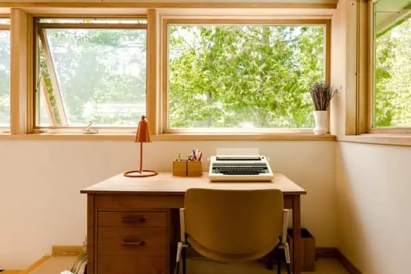 stylish wooden study table design with a table lamp and a few books on the top, modern study table for students