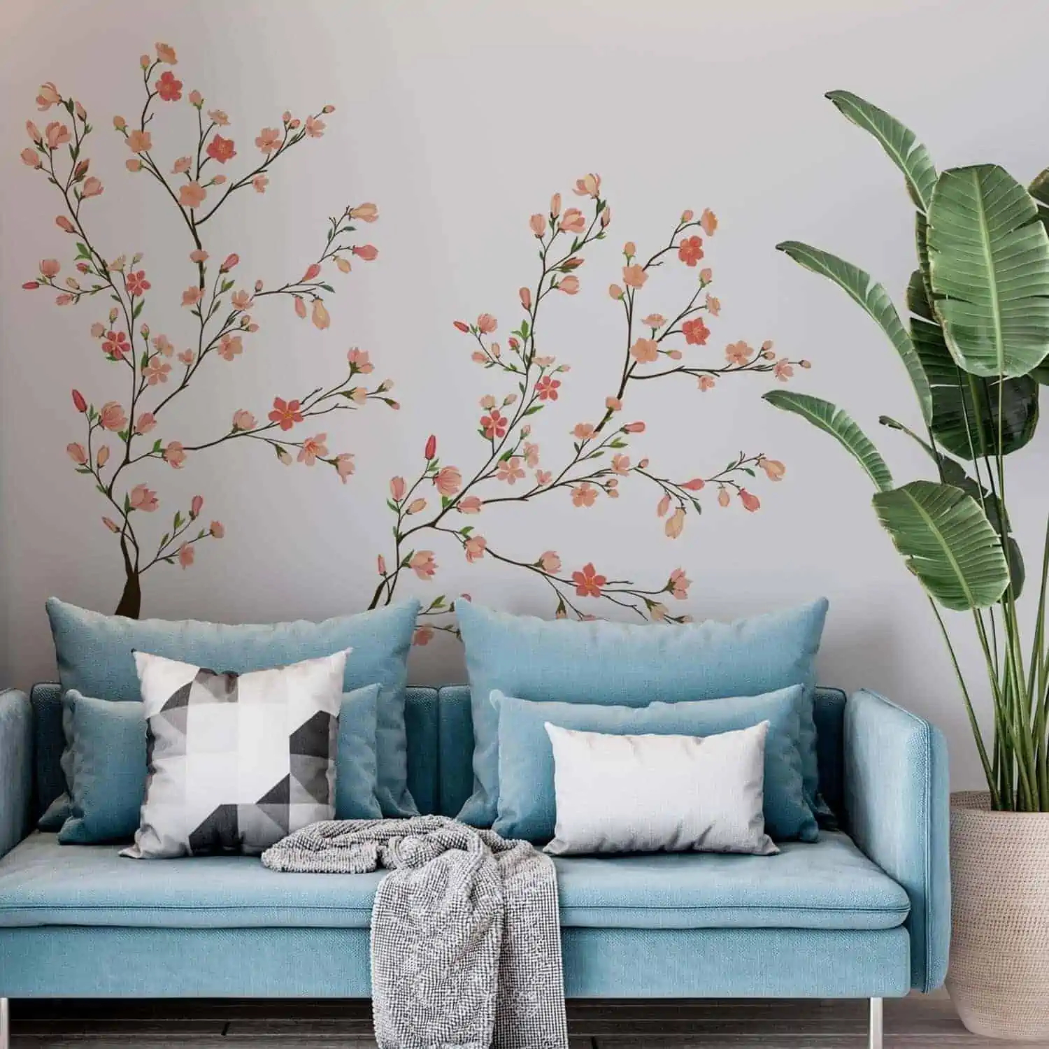 living room with indoor plants and blue sofas.