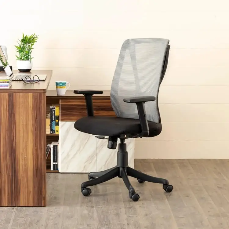 study station with wooden flooring and indoor plants, plastic office chair