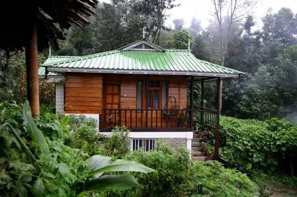 Side view of farmhouse with greenery