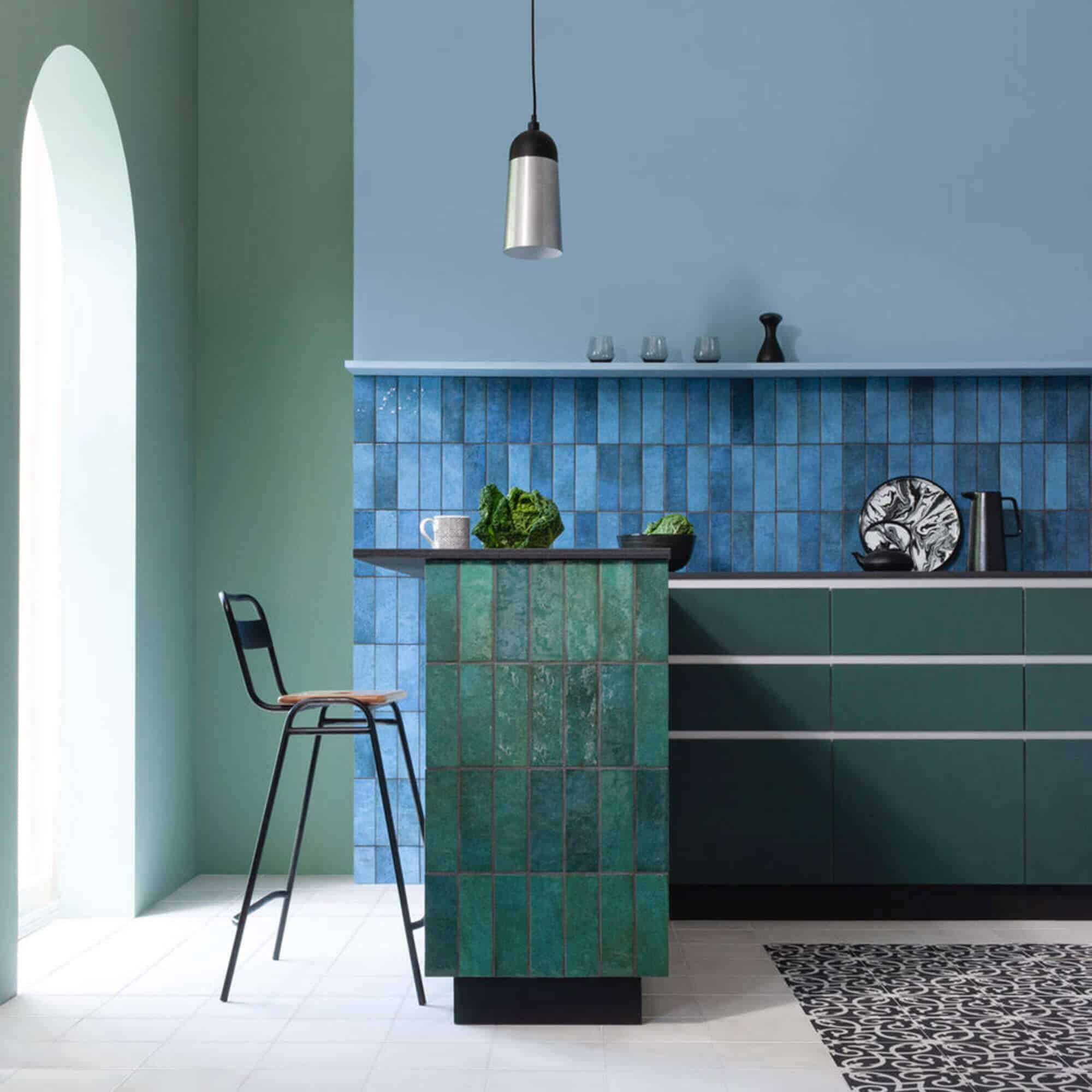 blue kitchen tiles on backsplash and green vertical tiles on breakfast bar
