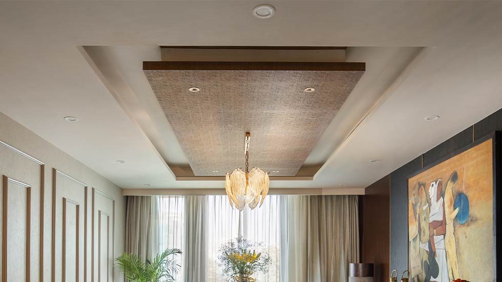 sophisticated dining room ceiling, wooden material, hanging light, dining table setting, indoor plants