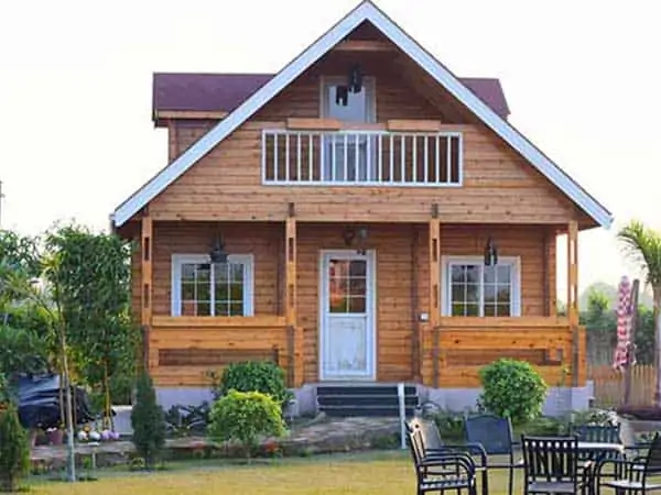 Wooden farmhouse with front garden
